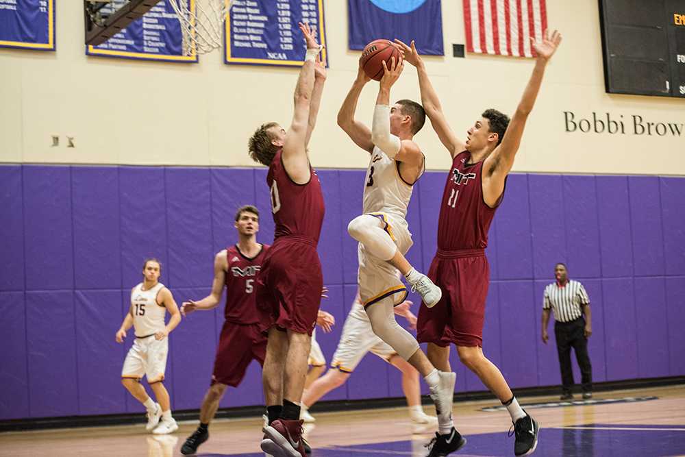 Emersons Geoff Gray drives to the basket against MIT. Gray is 43 points shy of 1,000 in his career.
