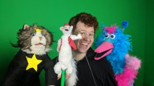 Pop goes the evil weasel in alum’s puppet show
