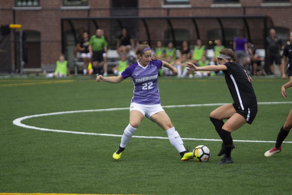 Jenna Case (No. 22) challenges for the ball in Emersons 1-0 victory over Wesleyan. Photo: Kyle Bray/Beacon Staff.