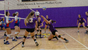 Fara Cohen (No. 23, center) lays out for the ball in Emerson's 3-1 loss to Coast Guard. Photo: Anissa Gardizy/Beacon Correspondent.
