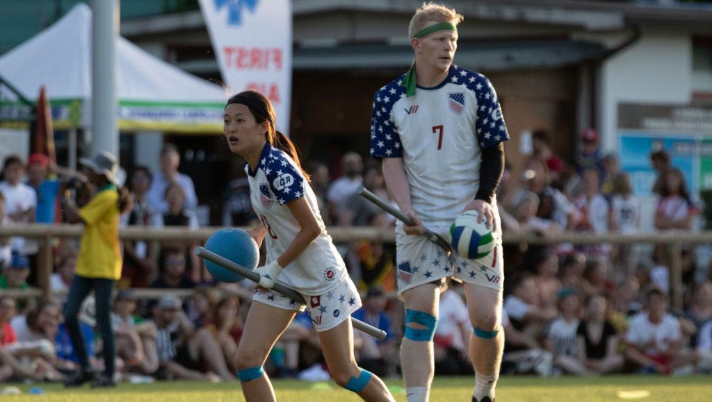Tyler Trudeau (right, No.7) stands alongside teammate Xu Lulu in a 2018 IQA World Cup match. Photo courtesy of Miguel Esparza/USA Quidditch. 