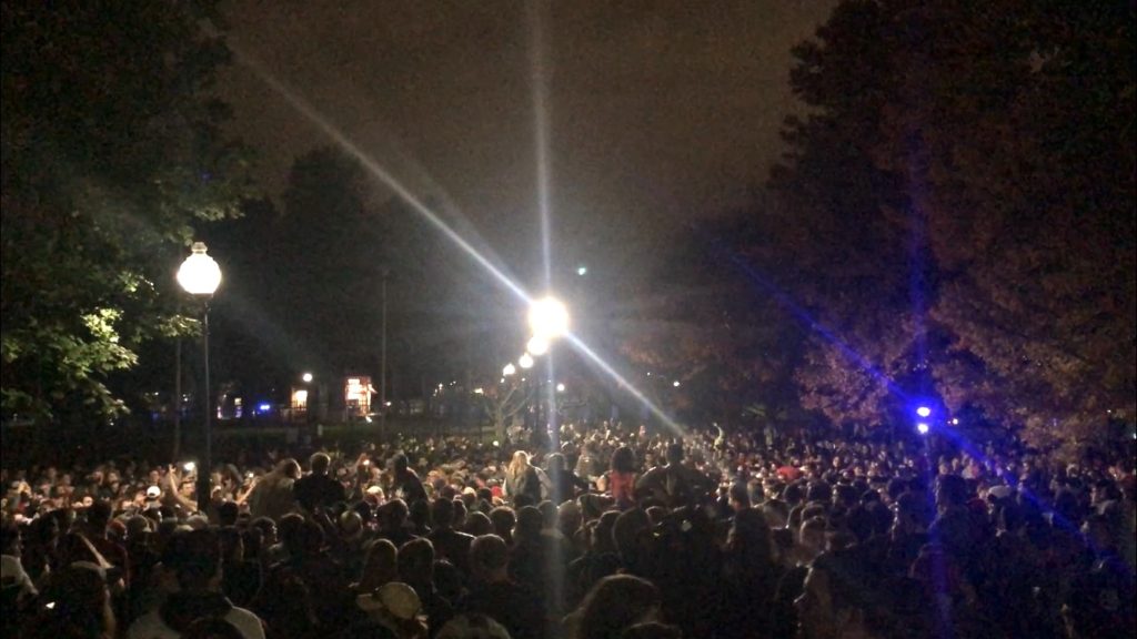 A crowd of about 1000 celebrated the Red Sox World Series Victory on the Boston Common Sunday. Chris Van Buskirk / Beacon Staff