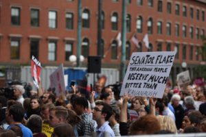 Emerson students oppose Sen. Jeff Flake at City Hall Plaza