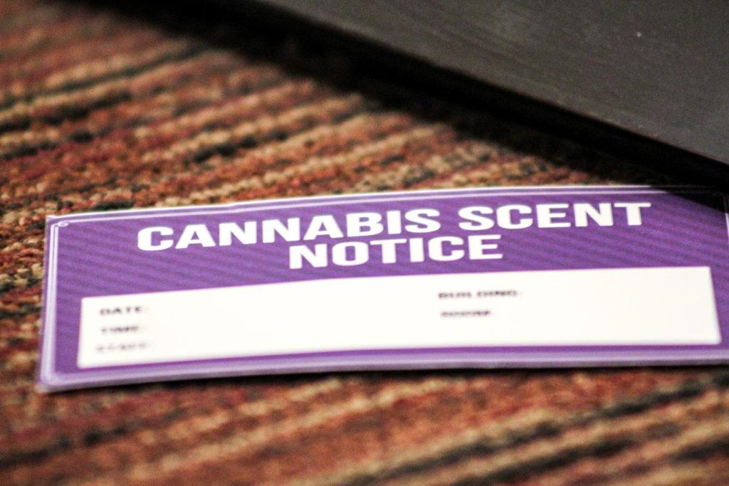 Resident Assistants leave Cannabis Scent notices under dorm room doors after pinpointing the smell of marijuana on a residence hall floor. Anissa Gardizy / Beacon Staff