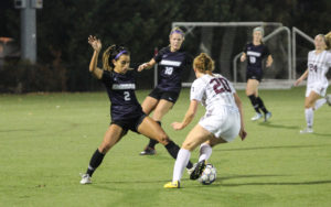 Amanda Benavente (No. 2) puts in a tackle on Springfield's Kaleigh Dale (No. 20). Photo by Anissa Gardizy / Beacon Staff