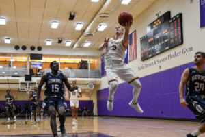 Geoff Gray (center, No. 3) is second on the men's basketball team in points per game with an average of 20.9. Photo by Anissa Gardizy / Beacon Staff