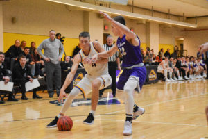 Jack O'Connor (No. 4) leads the NEWMAC in scoring with 21.6 points per game. Photo by Anissa Gardizy / Beacon Staff