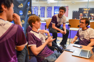 The Emerson College Esports 'Overwatch' team strategizes ahead of its matchup with Northeastern on Dec. 8. Photo by Anissa Gardizy / Beacon Staff