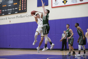 Junior (No. 4) Jack O'Conner added 14 points and 10 rebounds to the Lions' victory over Babson. Photo by Daniel Peden / Beacon Staff