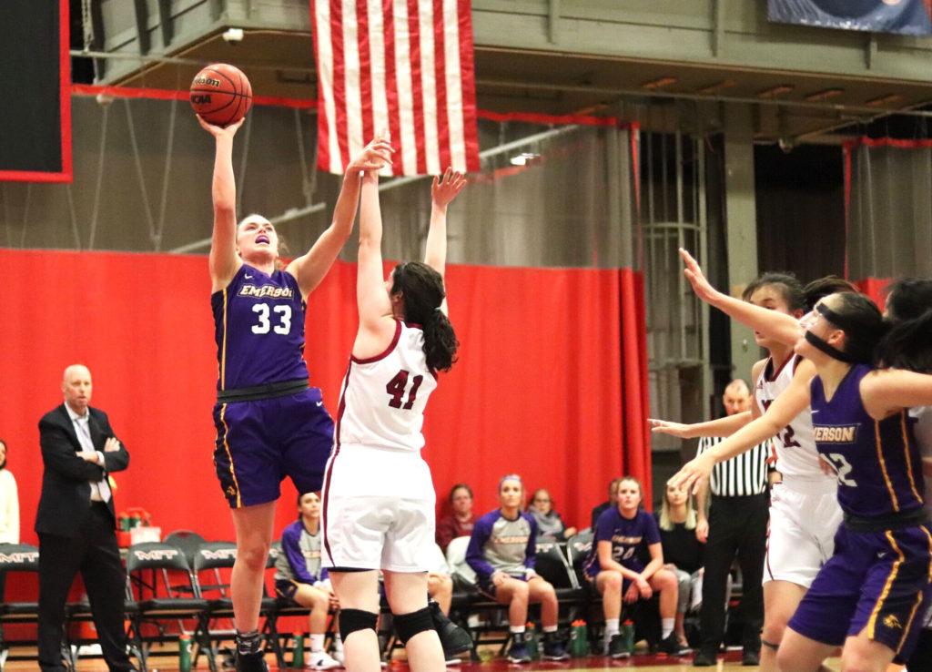 Senior Charlie Boyle (left, No. 33) goes up for a layup and senior Natalie Busch (right, No. 12) waits for the rebound in the NEWMAC quarterfinals against MIT. Photo by Arturo Ruiz / Beacon Correspondent 