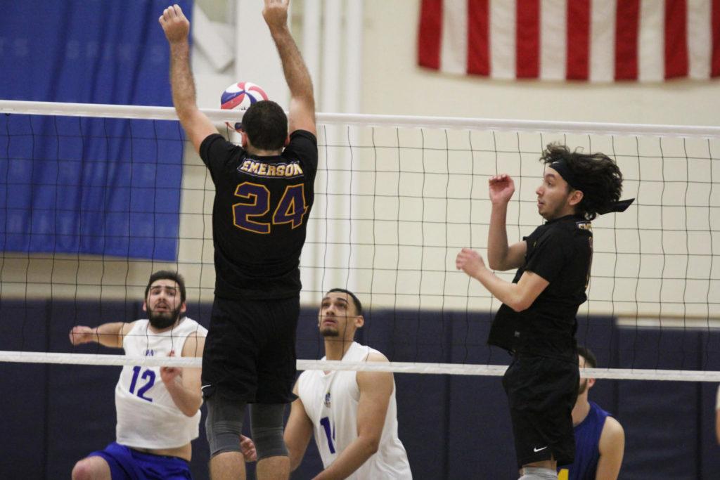 Sophomore middle blocker Samuel Willinger (left) totaled 7 points on 23 attacks in the Lions loss to Emmanuel College. Photo by Aaron J. Miller / Beacon Staff
