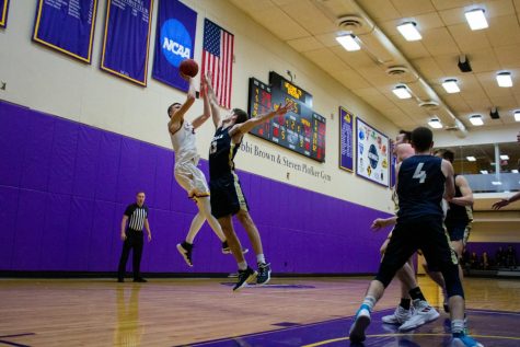 Men’s basketball edges past Suffolk in first game back from break