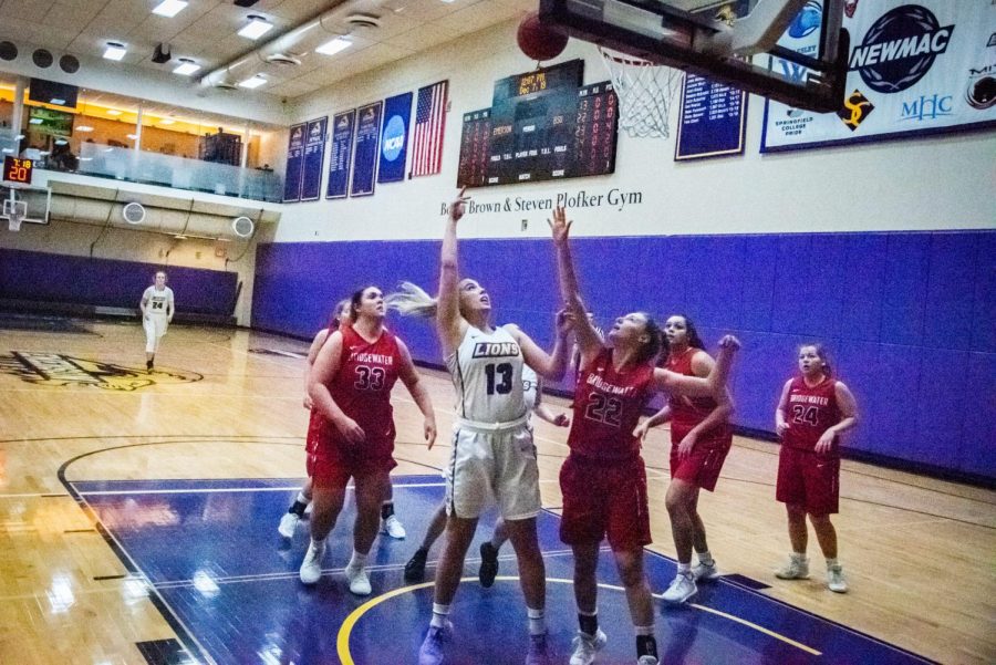 Senior Quinn Madden (center, No. 13) goes for a layup against Bridgewater St. on Saturday.