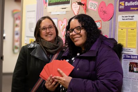 SEIU members hold up Valentine's cards inviting staff members to an event on Feb. 14. Tivara Tanudjaja