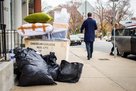 A pile of belonging rests curbside as one of the hundreds of Emerson students who live on campus squeezed everything they owned into their car.