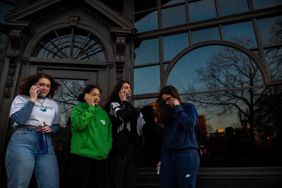 First year students left to right: Carrie Aubin, Chloe Shaar, Eva Charbonnnier, and Isabella Espejo, calling their parents about the colleges decision to shut the Boston campus down.
