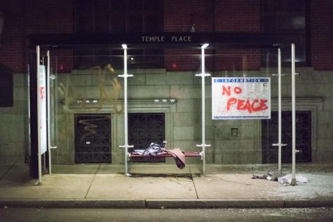The Temple Place bus stop sat quietly after the protesters were pushed onto Tremont Street. 