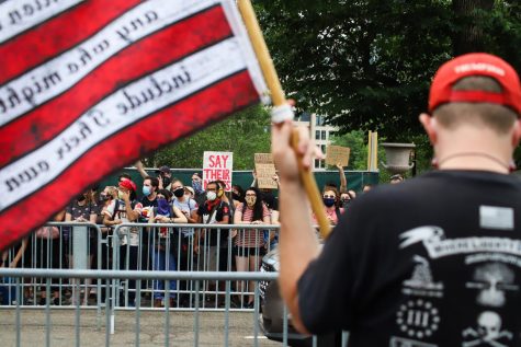 Protesters and counter protesters exchanged shouted insults from across the street.