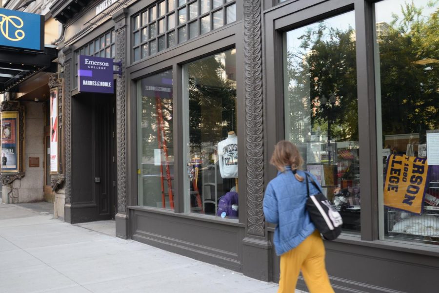A student walks past the Emerson College Barnes & Noble. 
