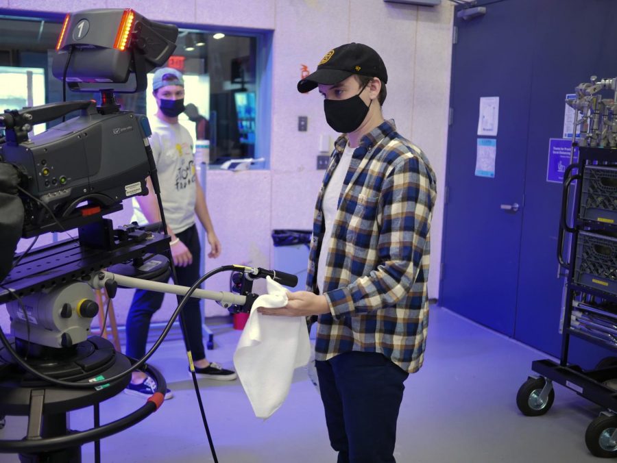 Student Government Association Executive Treasurer Thomas Coughlin operating a camera in a visual and media arts course. 