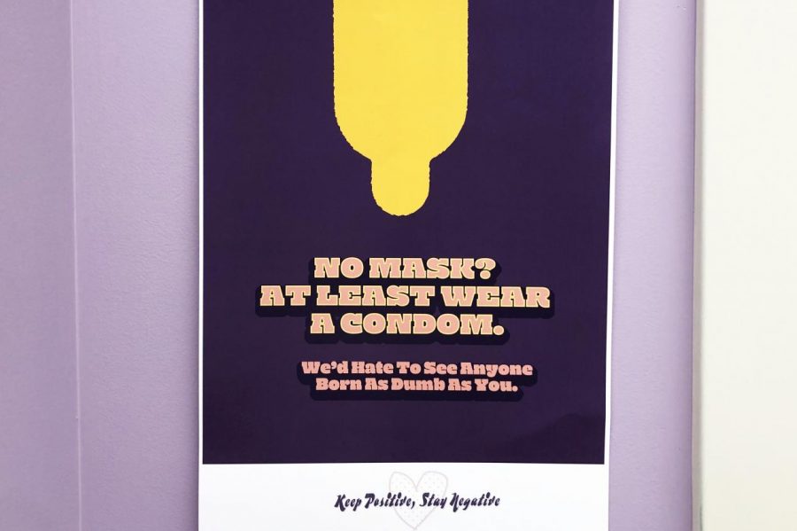A poster within Little Building asking students to practice safe sex. 
