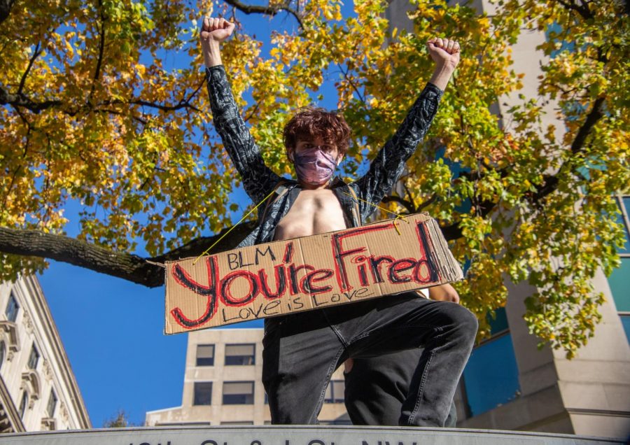 A+Washington+D.C.+man+displays+a+Youre+Fired+sign.