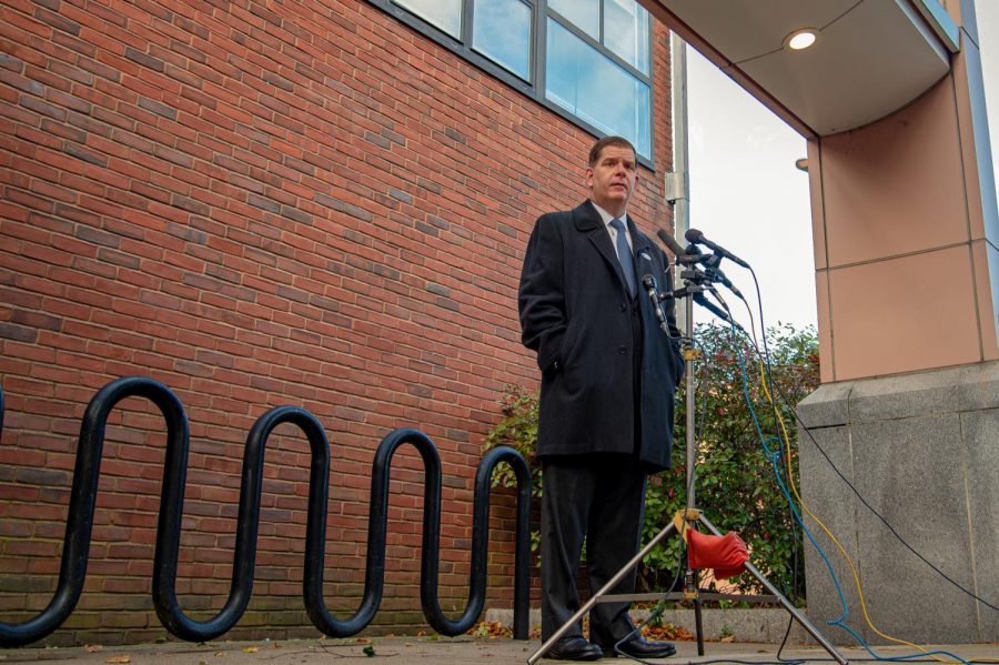 Marty Walsh speaks to reporters after casting a vote for Presidential Candidate Joe Biden at The Lower Mills branch of The Boston Public Library on November 3, 2020.