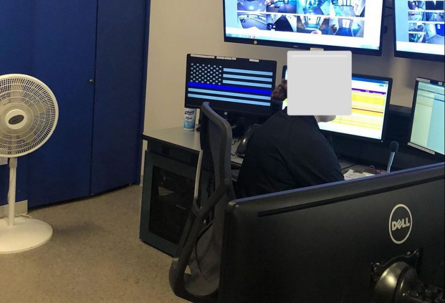 A "Thin Blue Line" flag was displayed on a computer in the Emerson College Police Department office in August 2018. (NOTE: This photo was provided to The Beacon by a community member with the face of the dispatcher covered)