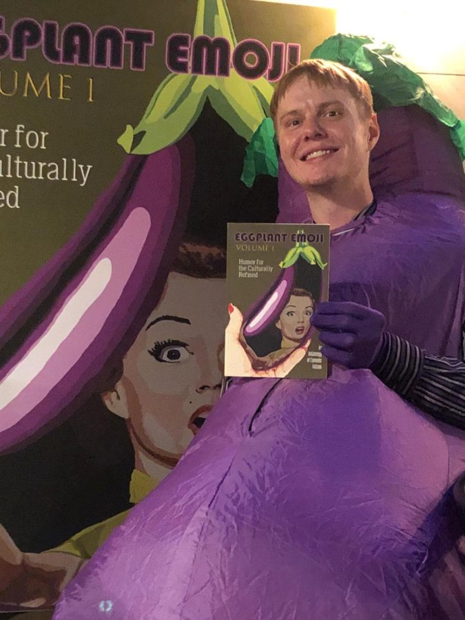 James P.W. Martin 13 posing with his new anthology, Eggplant Emoji Volume 1.