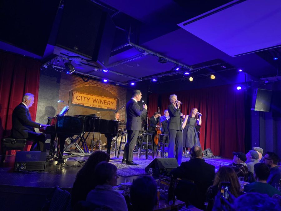 Tim Davis (left), Jane Lynch (middle), and Kate Flannery (right) performing A Swinging Little Christmas at City Winery, with The Tony Guerrero Quintet on the instruments. 