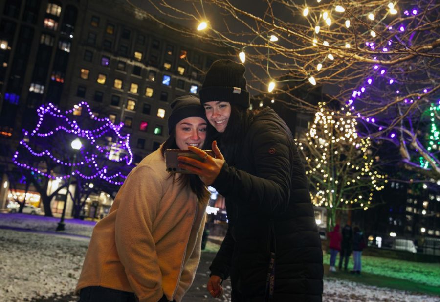Boston, MA: December 8, 2021 – First-year students Ellie McCabe and Emma Paiva take a selfie on Boston Common in the snow Wednesday night.