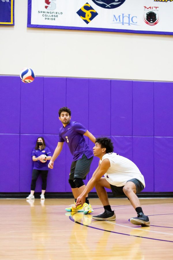 Sophomore middle/outside Neiko Pittman attempts a dig against Nichols College.