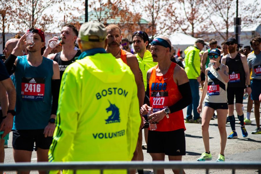 Boston+Marathon+runners+rehydrate+after+finishing+the+race.