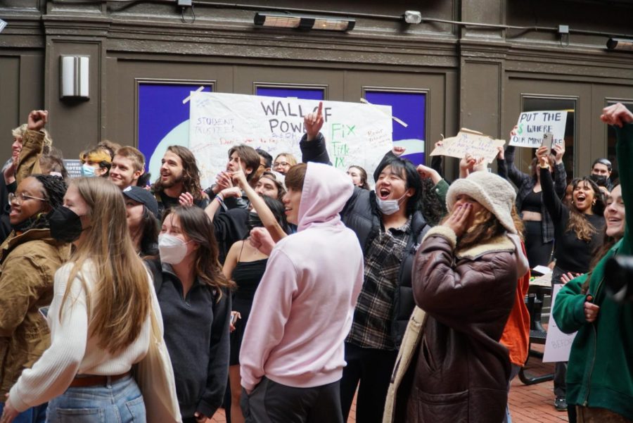 Students gathered in the 2 Boylston Place alleyway for a tuition protest April 1, 2022.