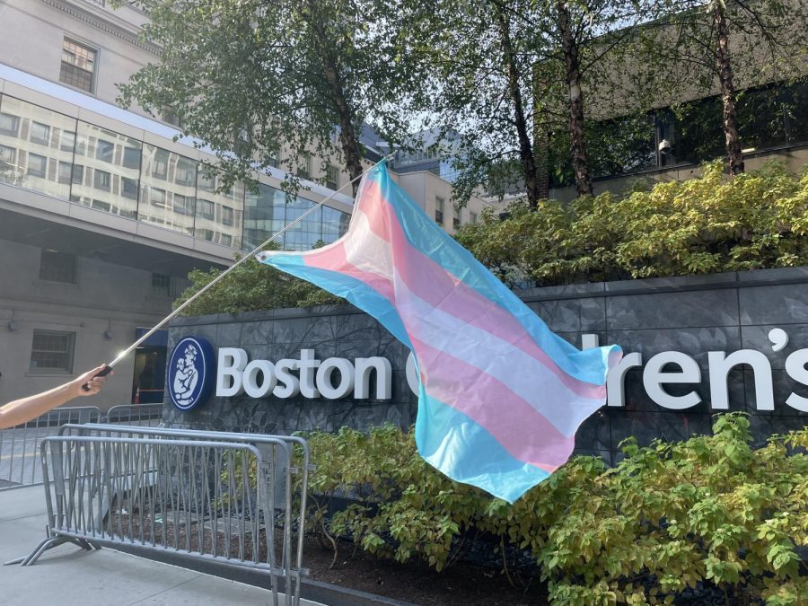 Trans flag waving in front of Boston Children’s Hospital.