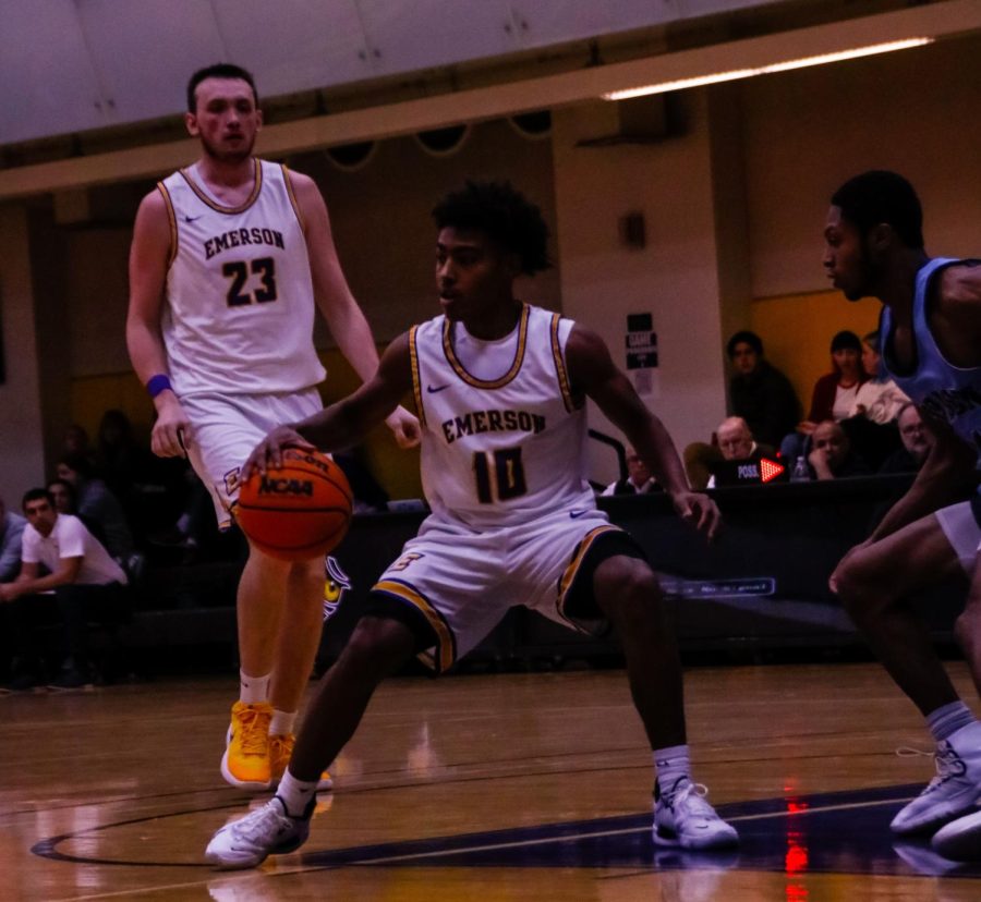 First-year PG Jacob Armant drives through the Fighting Scots defense.