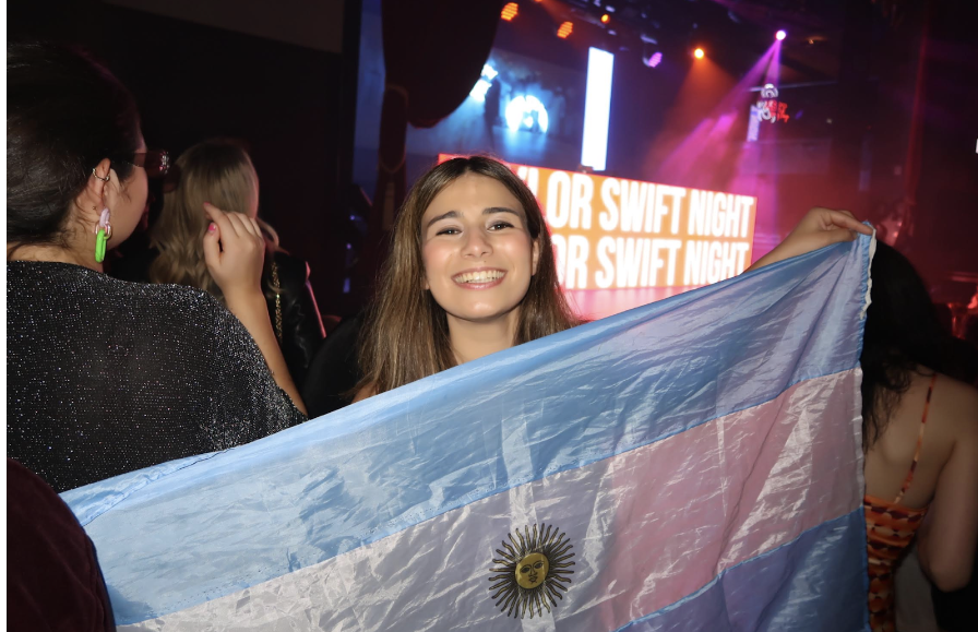 Gigi pictured with her flag she brought to the party supporting her country.