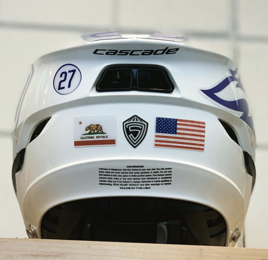 A mens lacrosse helmet bearing the California Republics flag.