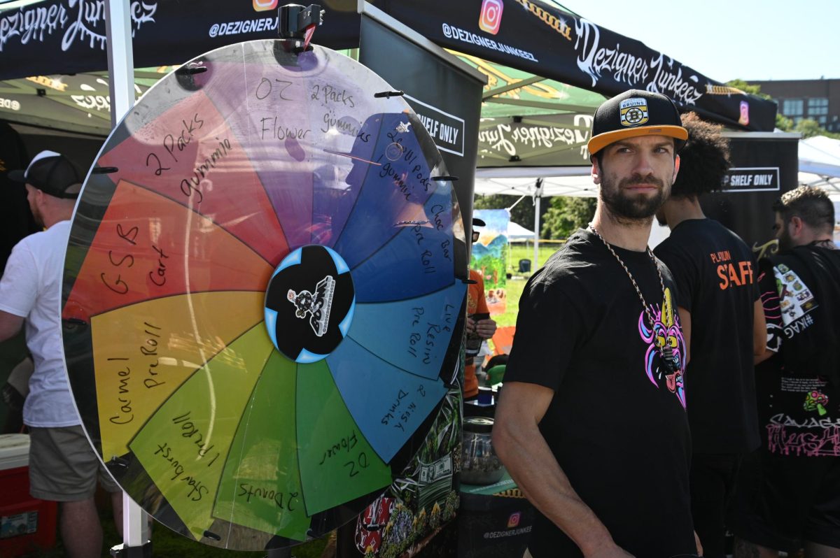 A Hawker for one of the stands at the 2023 Freedom Rally. For a small fee, fairgoers could spin the wheel for certain prizes.