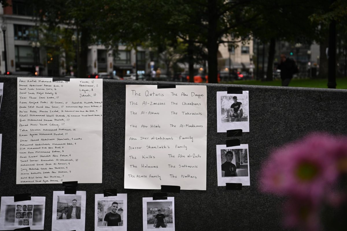 Two posters displaying the names of Palestinian families and children killed in Israels response to the Oct. 7 attacks. Individuals gather at The Embrace statue on Boston Common to mourn the civilians lost in the bombings in Palestine.