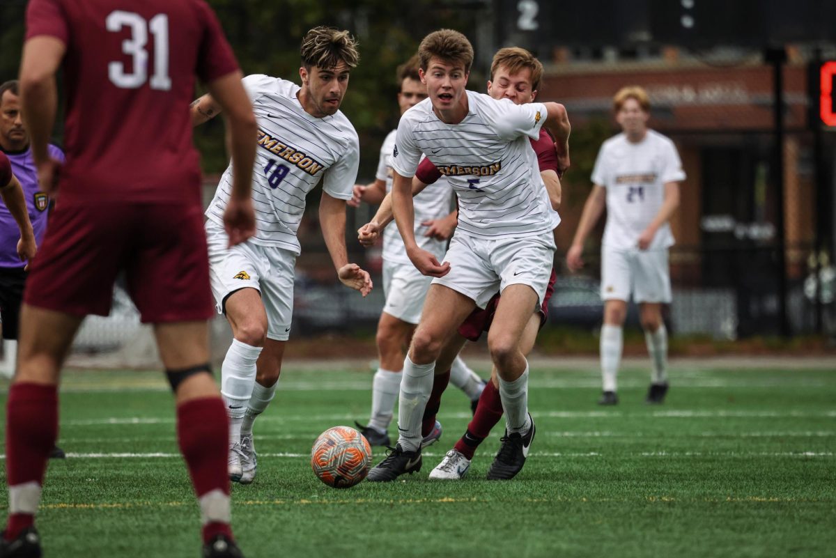 Emersons Thomas Pelino (18), left, and Theodore Bushara (5), right, try to maintain possession during the game against MIT at Rotch Playground in Boston, on Saturday, Oct. 14, 2023.