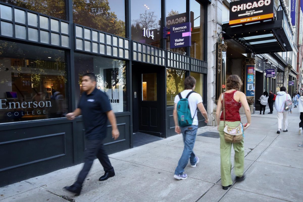 Students pass by the Emerson College Visitor Center.