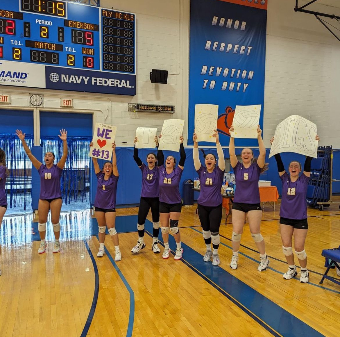 The Emerson womens volleyball team celebrating senior captain Caroliine Daviss 1,000th career dig. (Photo courtesy of Ben Read)
