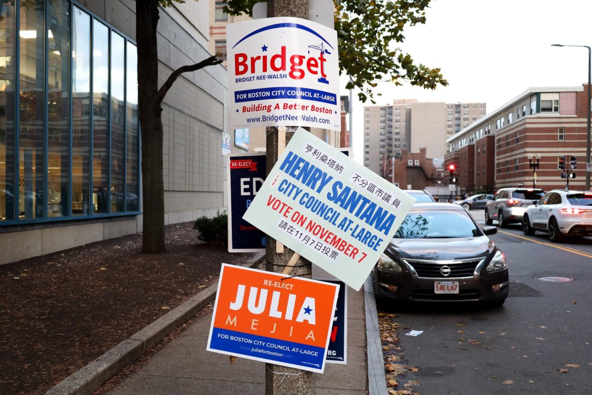 Campaign signs hang from the street lamps outside of the Chinatown YMCA where voters cast their ballots. 