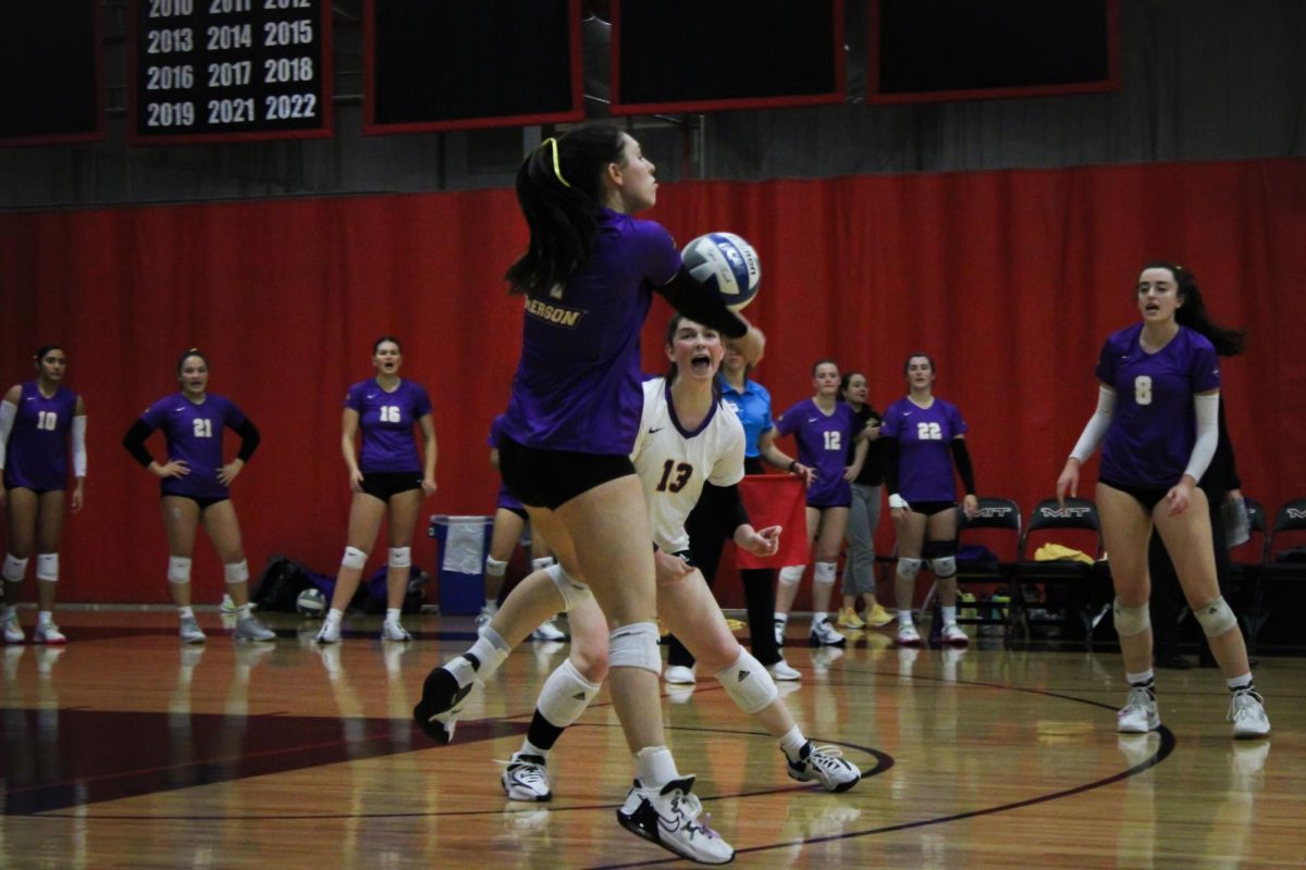 Freshman outside Rachel Dickerson (17) with a pass in serve receive against MIT in the 2023 NEWMAC Quarterfinals. (Riley Goldman for The Beacon)