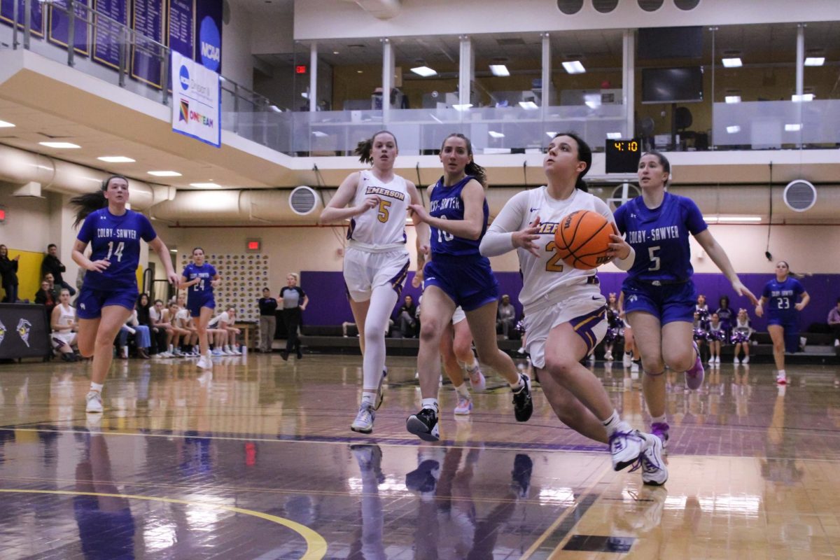 Sophomore point guard Bri Frongillo (2) drives to the basket against Colby-Sawyer on Saturday, Nov. 11, 2023. (Riley Goldman/ Beacon Archives)