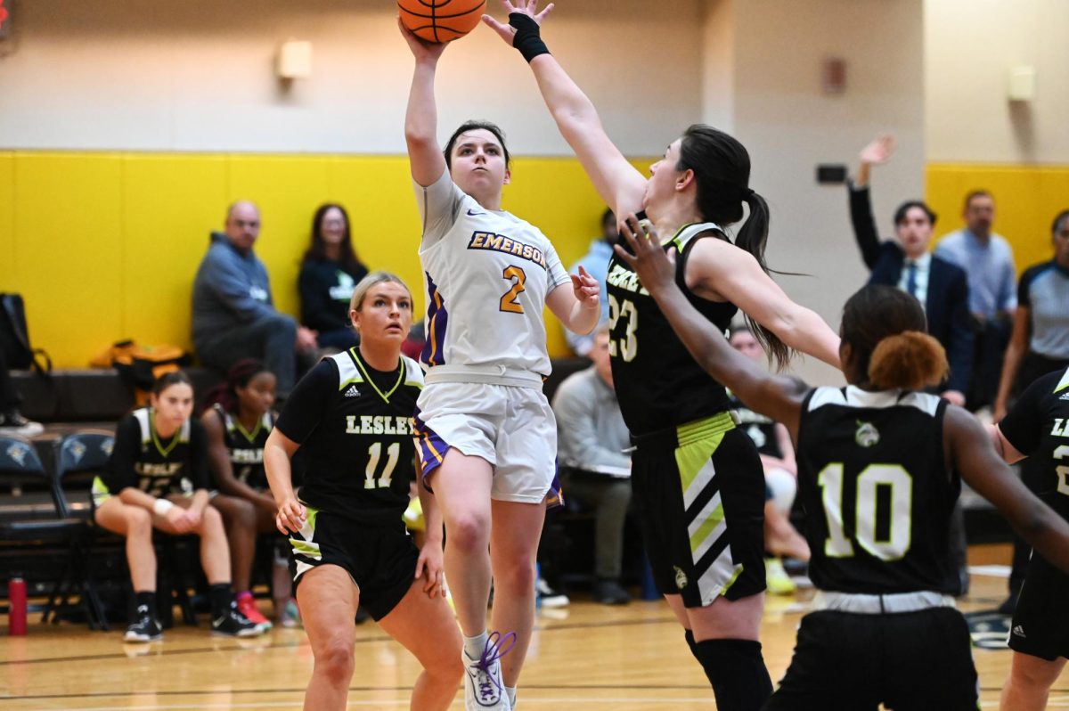 Sophomore guard Bri Frongillo shoots over her defender as the Lions take on the Lesley Lynx on Tuesday, Dec. 5, 2023.