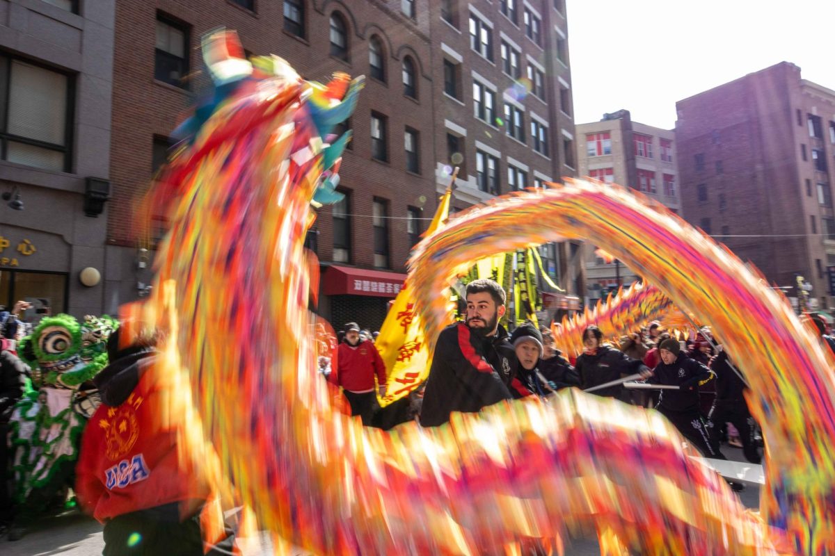 Performers present a dragon dance during the parade in Boston’s Chinatown on Sunday, Feb. 18, 2024. (Rian Nelson/Beacon Correspondent)