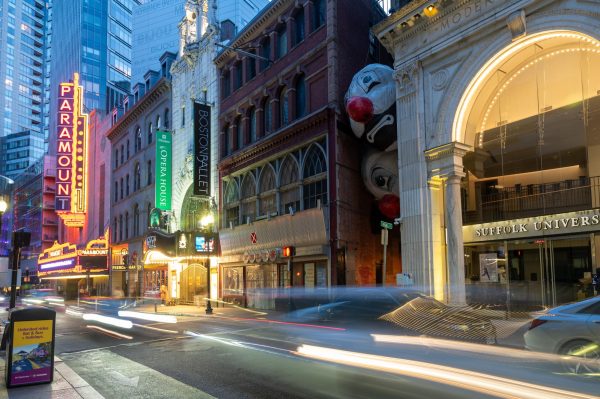 The “clown heads”—Endgame (Nagg & Nell) by Max Streicher, a part of a Canadian art experience in Downtown Boston called Winteractive, is hung between two buildings on Washington Street, next to the Paramount Center in Boston. (Frank Chen/Beacon Correspondent)
