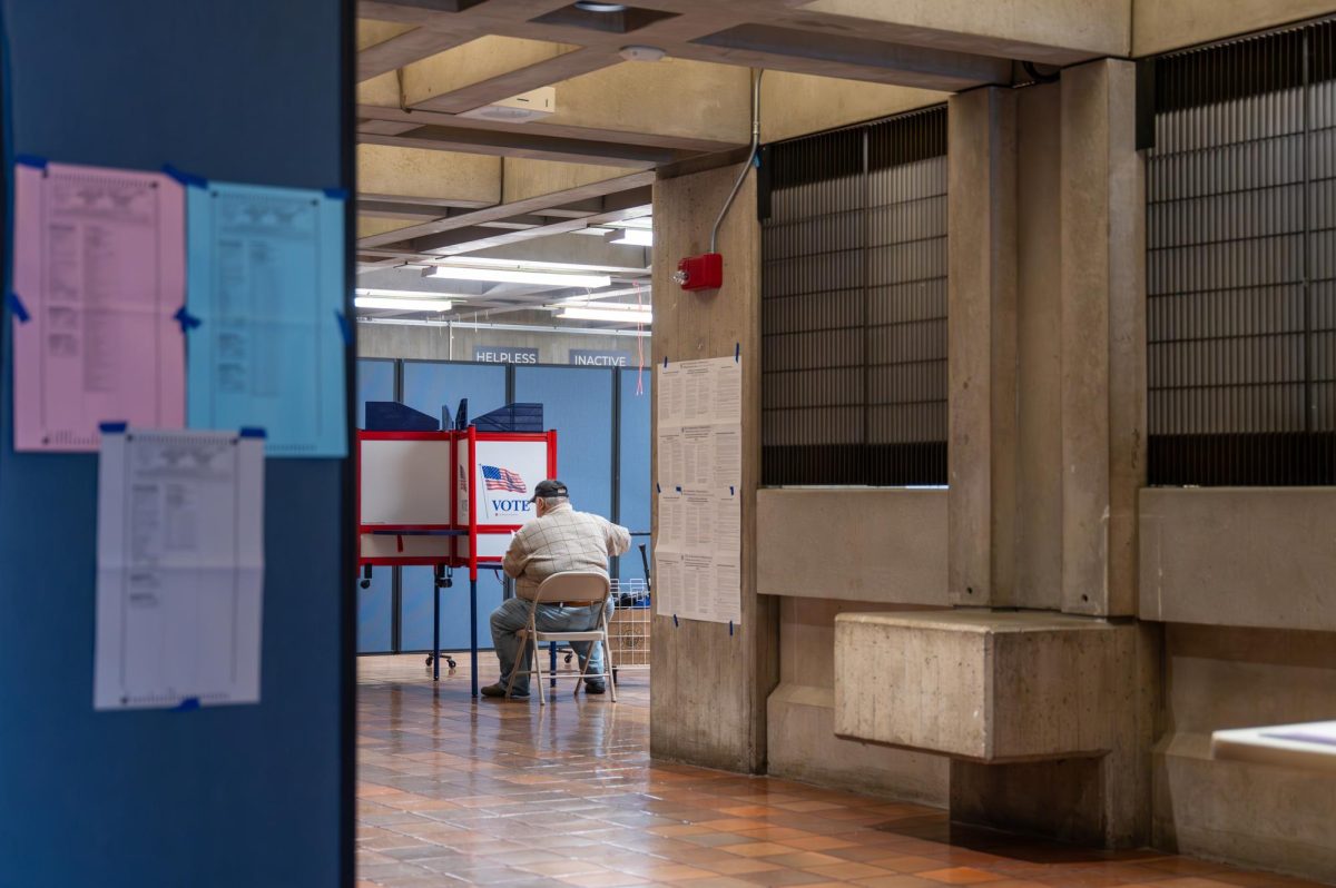 A Boston resident votes at a polling place within the Boston City Hall on March 5, 2024. (Feixu Chen/Beacon Staff)
